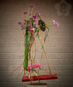 Flower arrangement using tubes and a handmade framework using recycled materials